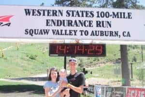 Coach Andrew Taylor, Nicole and Samuel under the start clock at Western States 100