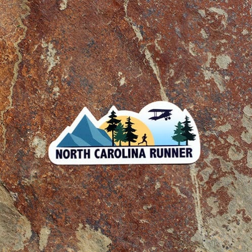 North Carolina Running Sticker on rock background