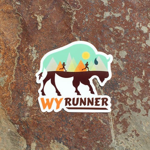 Wyoming Running sticker on rock background