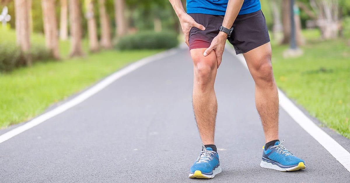 Runner dealing with Iliotibial Band Syndrome or IT Band Syndrome