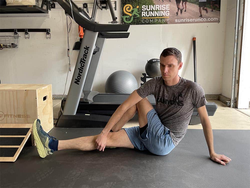 Coach Andrew Taylor demonstrates a Seated Twist exercise