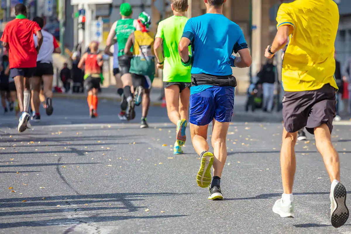 Runners participating in a city road marathon during a long-distance race event