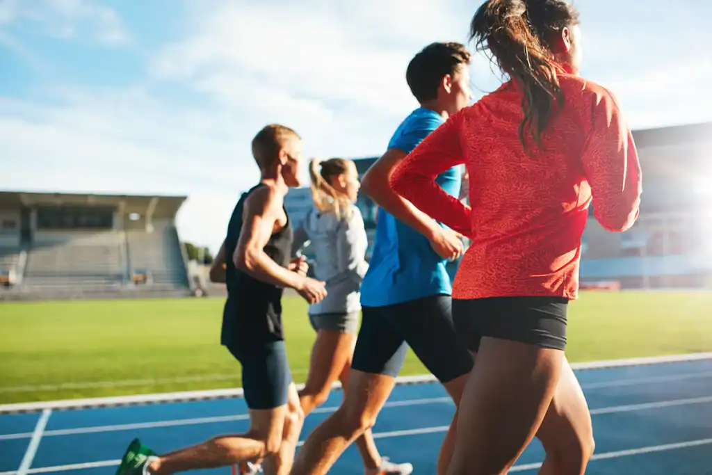 group of runners completing track workout during the advanced half marathon training plan